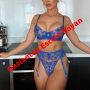 Woman in blue lace lingerie posing in a modern kitchen with a bold red diagonal 'Gaziantep Escort Bayan' watermark, indicating an escort advertisement.