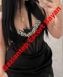 Partial view of a woman in a low-cut black dress with gold jewelry, overlaid by red diagonal text reading 'Gaziantep Escort Bayan'.